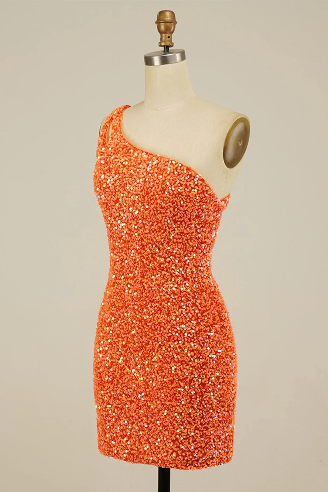 Side profile of a woman wearing the sequined mini dress.
