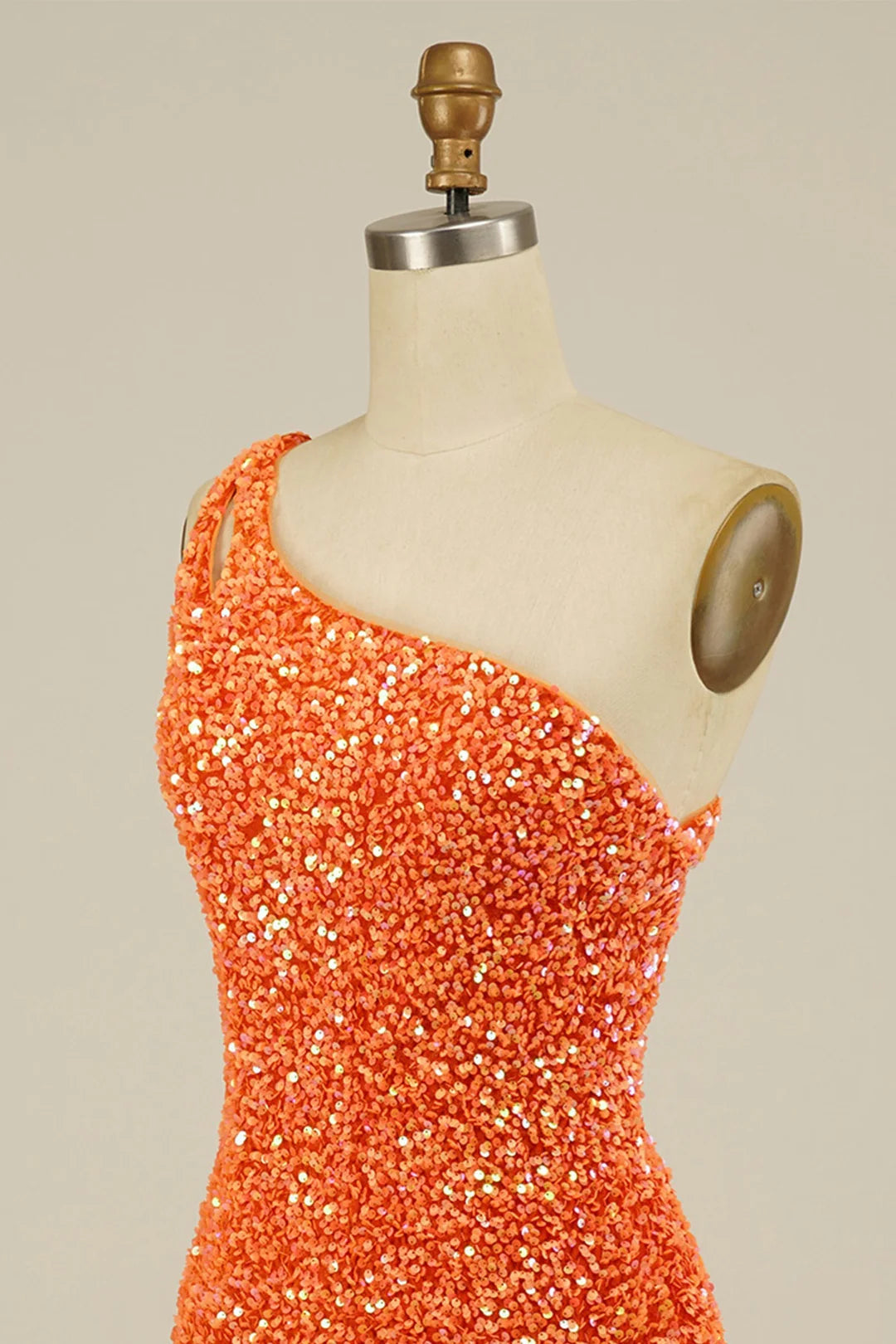 Model showcasing the fitted silhouette of the sequin sheath dress.