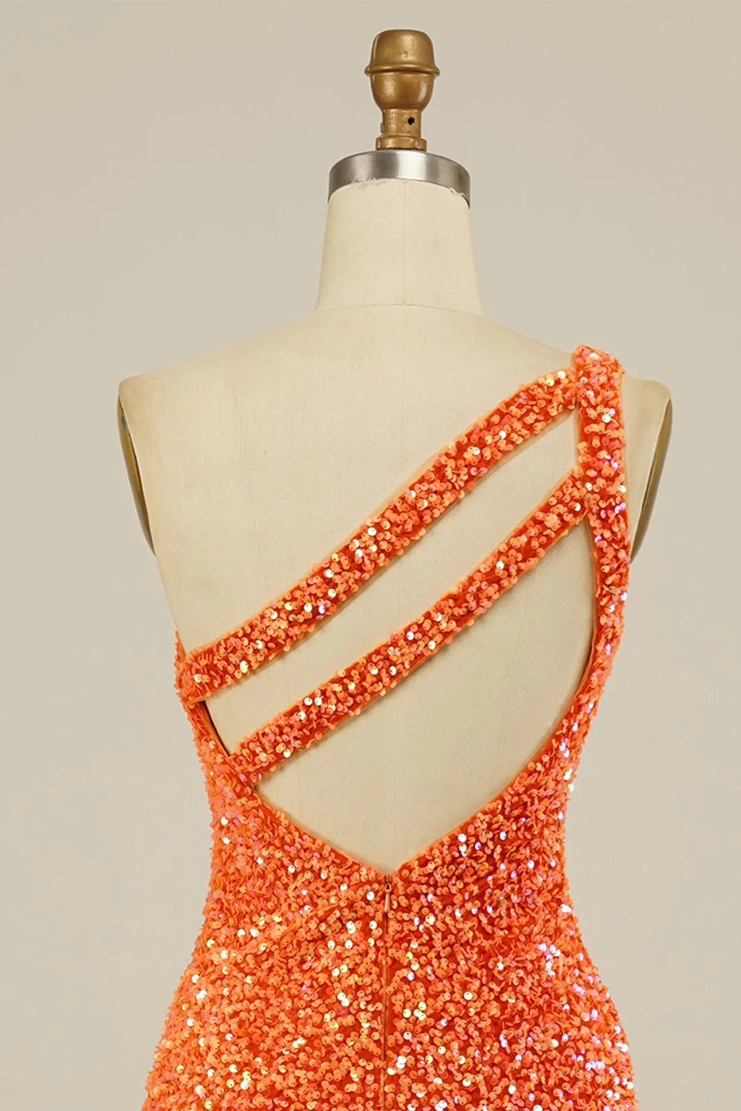 Full length view of the sparkling one-shoulder mini dress.