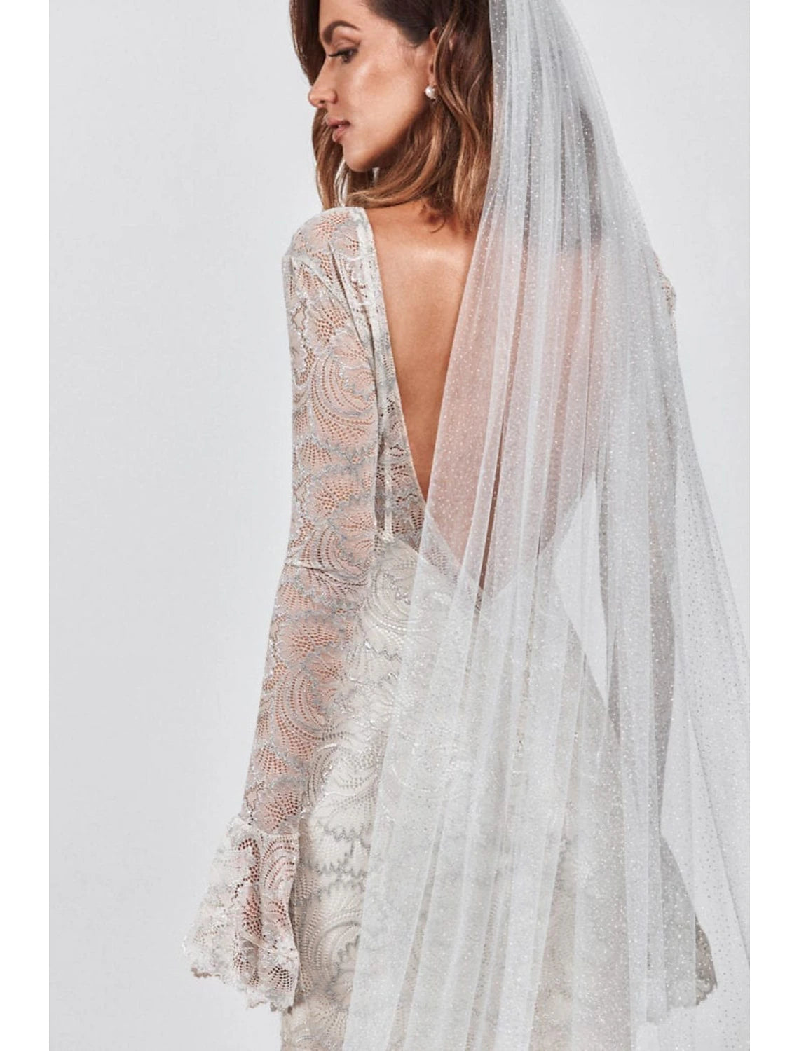 Close-up of sequin details on a sparkling tulle wedding veil.