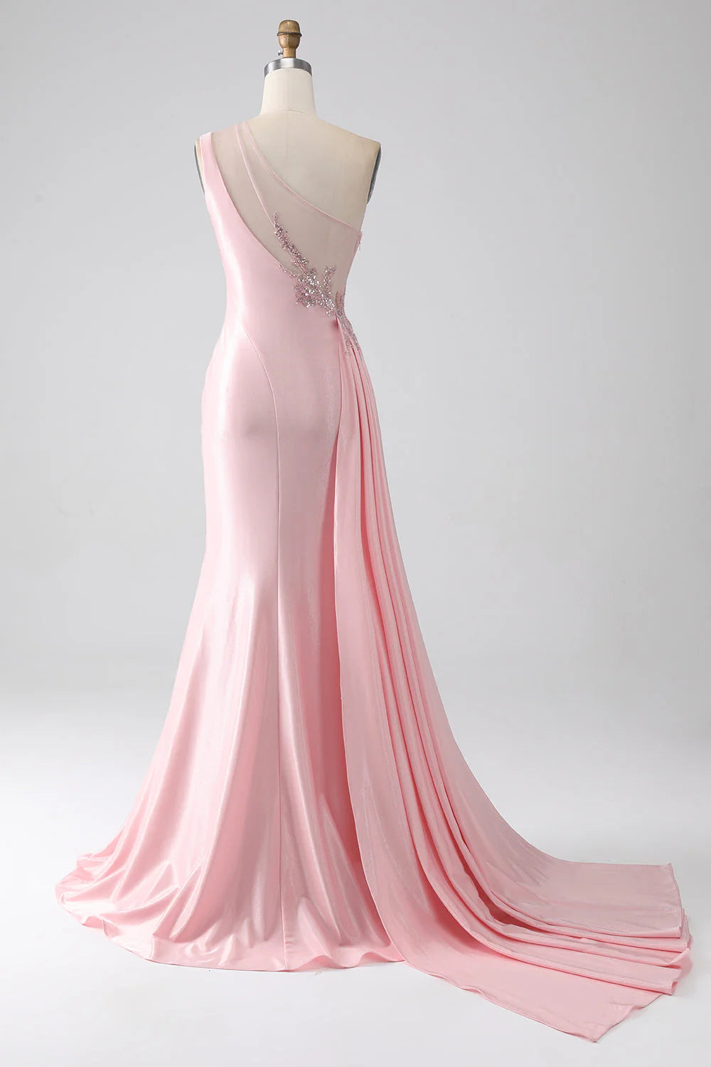 Side view of pink sequin mermaid dress showing ruched detail and leg slit.