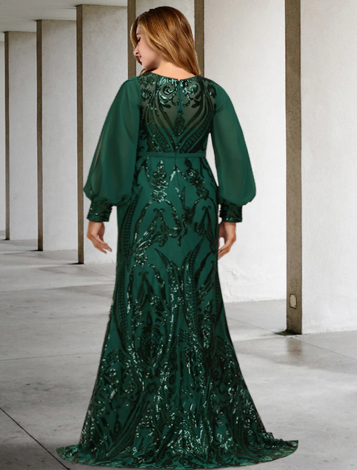 Side view of the long sleeve jewel neck formal dress.