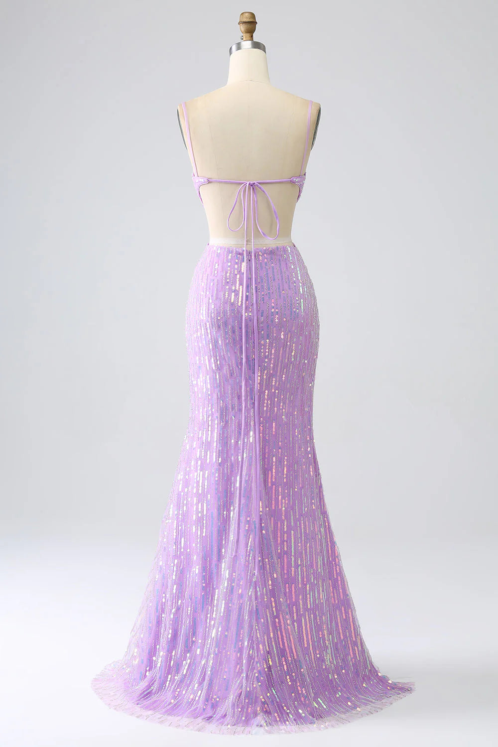 Side view of the purple mermaid sequin prom dress, highlighting the elegant slit.