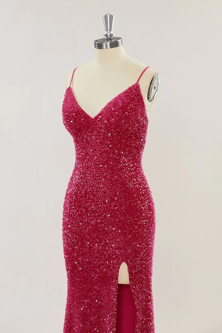 Close-up of the intricate sequin detail on a red mermaid evening dress.