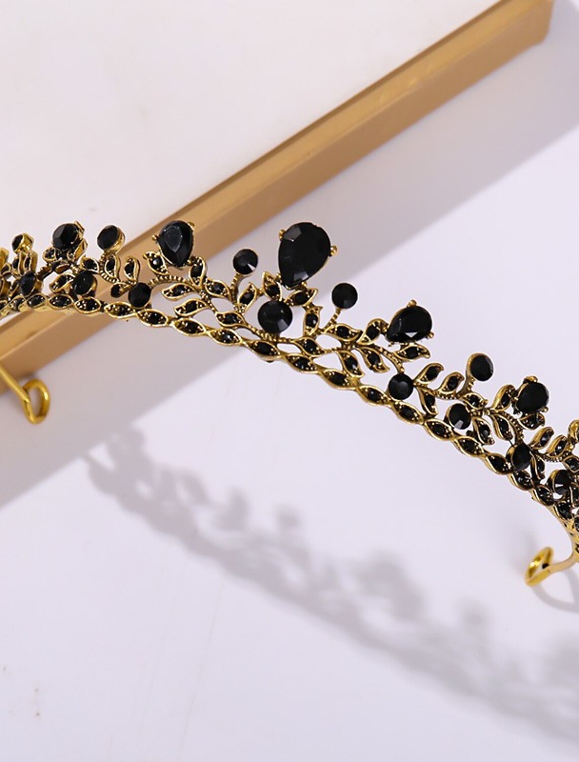 Close-up of a princess tiara showcasing its brilliant metal crystals.