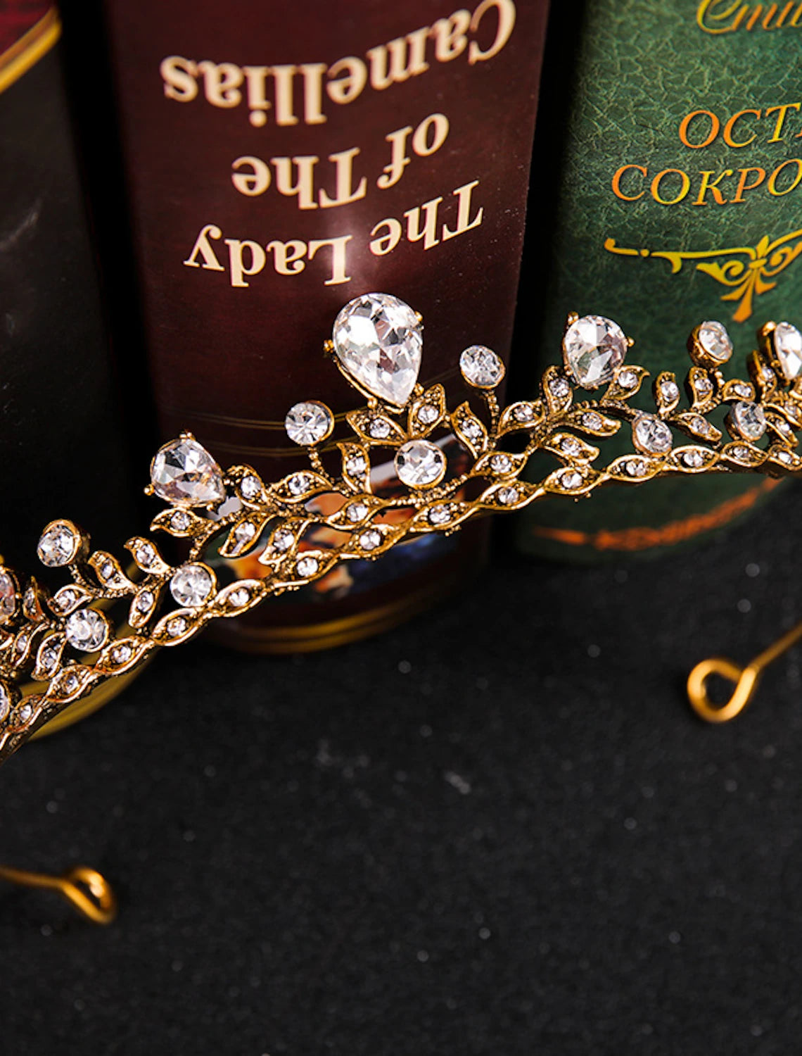 Side view of a wedding hair accessory adorned with rhinestones and a regal design.