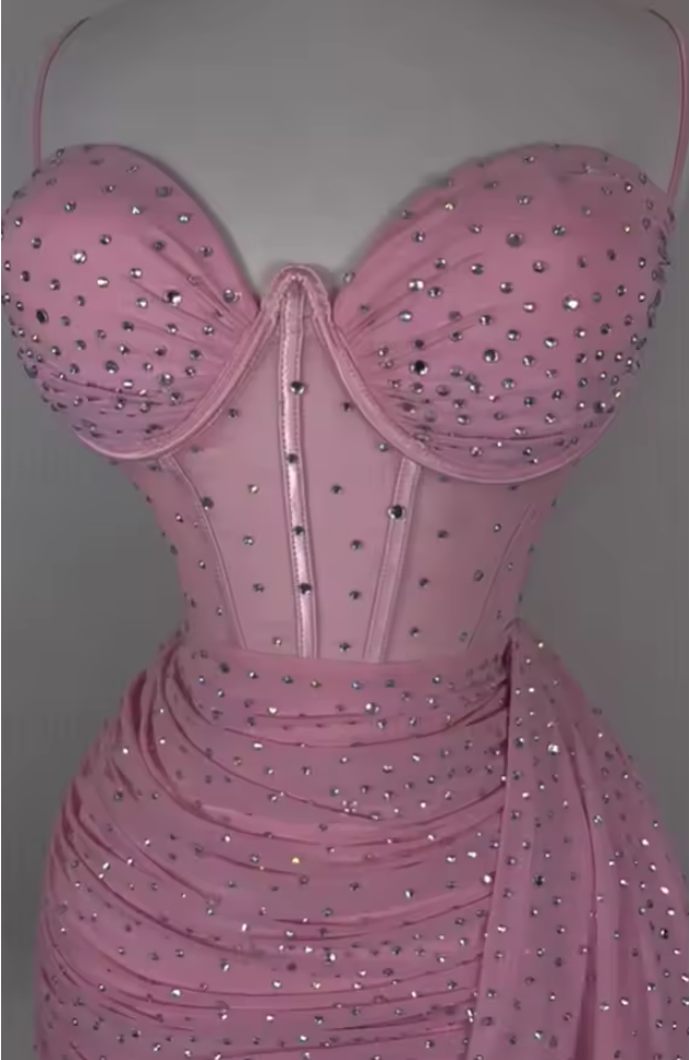 Close-up of the sequin detail on an elegant short V-neck dress.