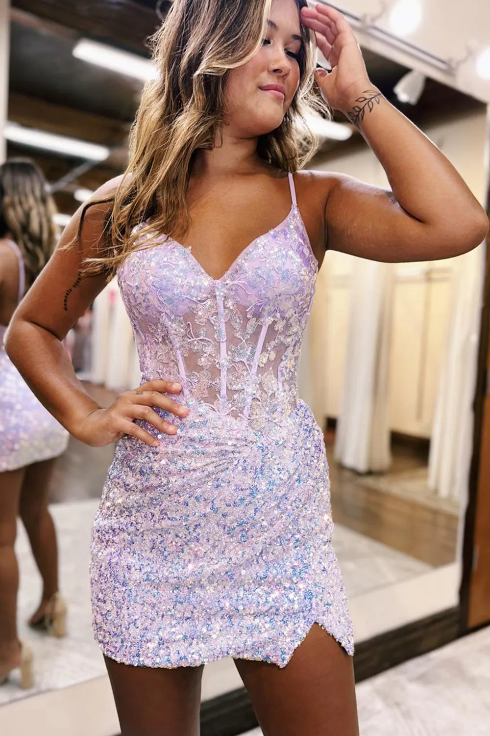 Model wearing a lilac glitter sequin bodycon homecoming dress with spaghetti straps.