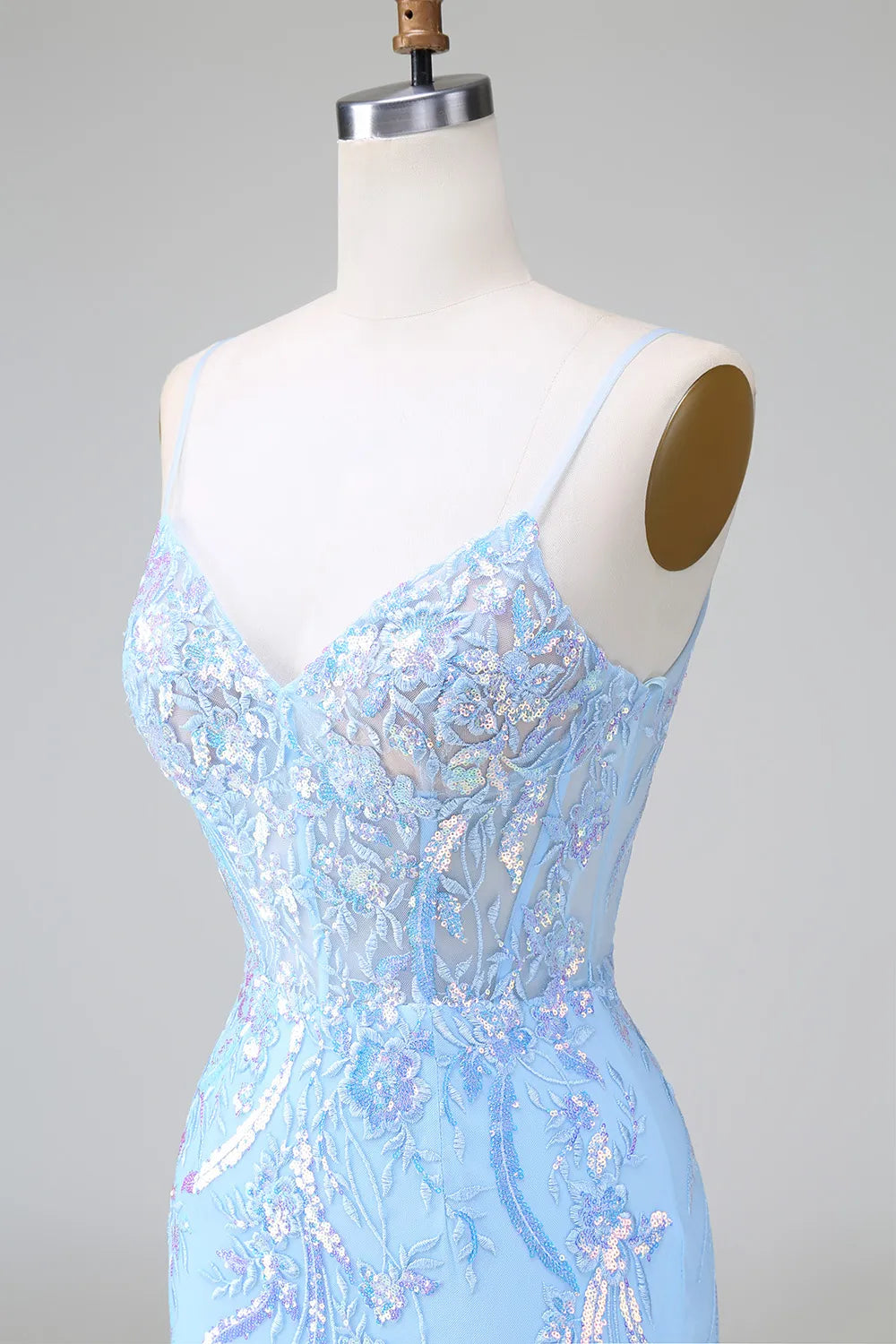 Close-up of blue sequin fabric on bodycon dress.