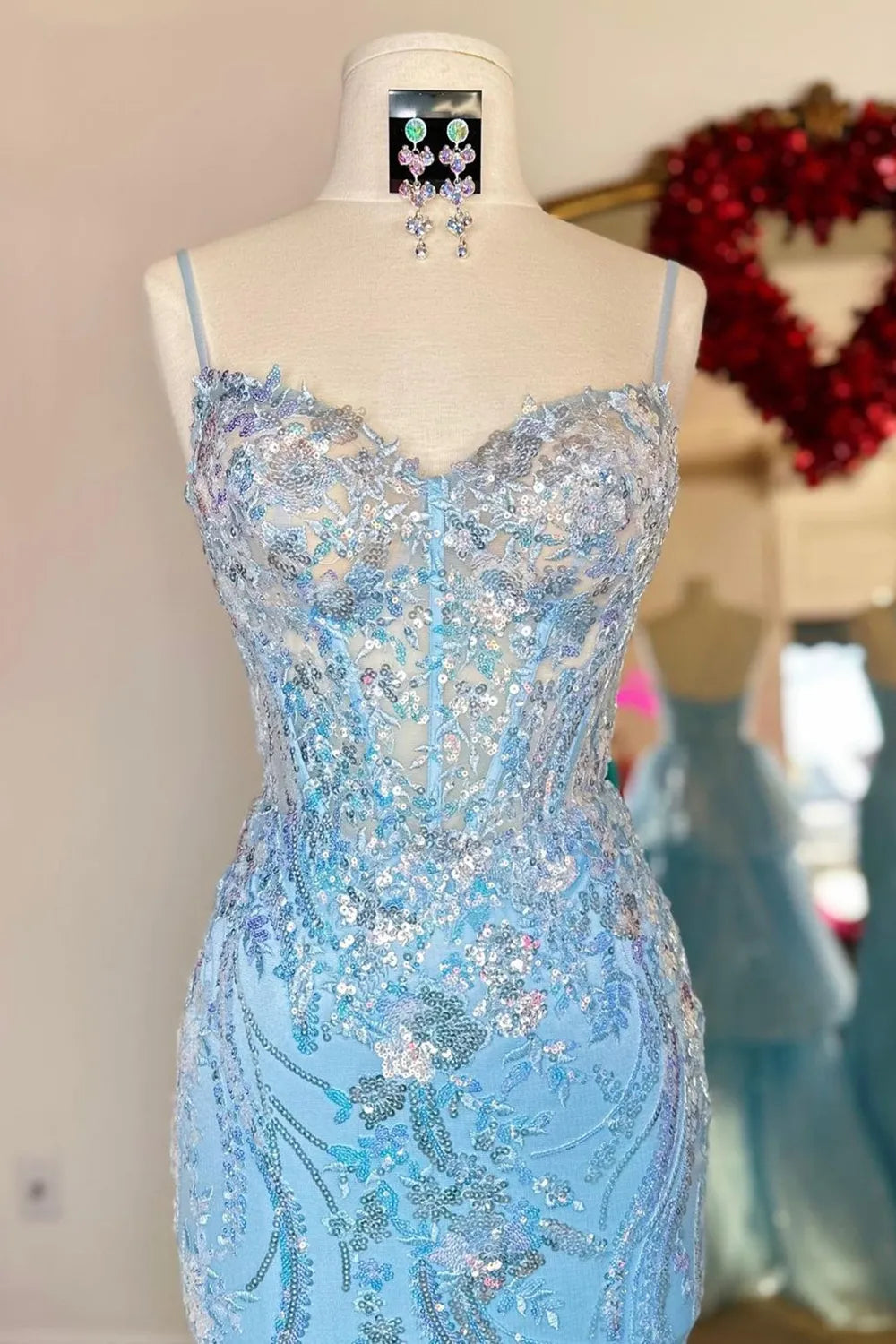 Another full length view of the woman in the sequin mermaid prom dress, showcasing its overall design.