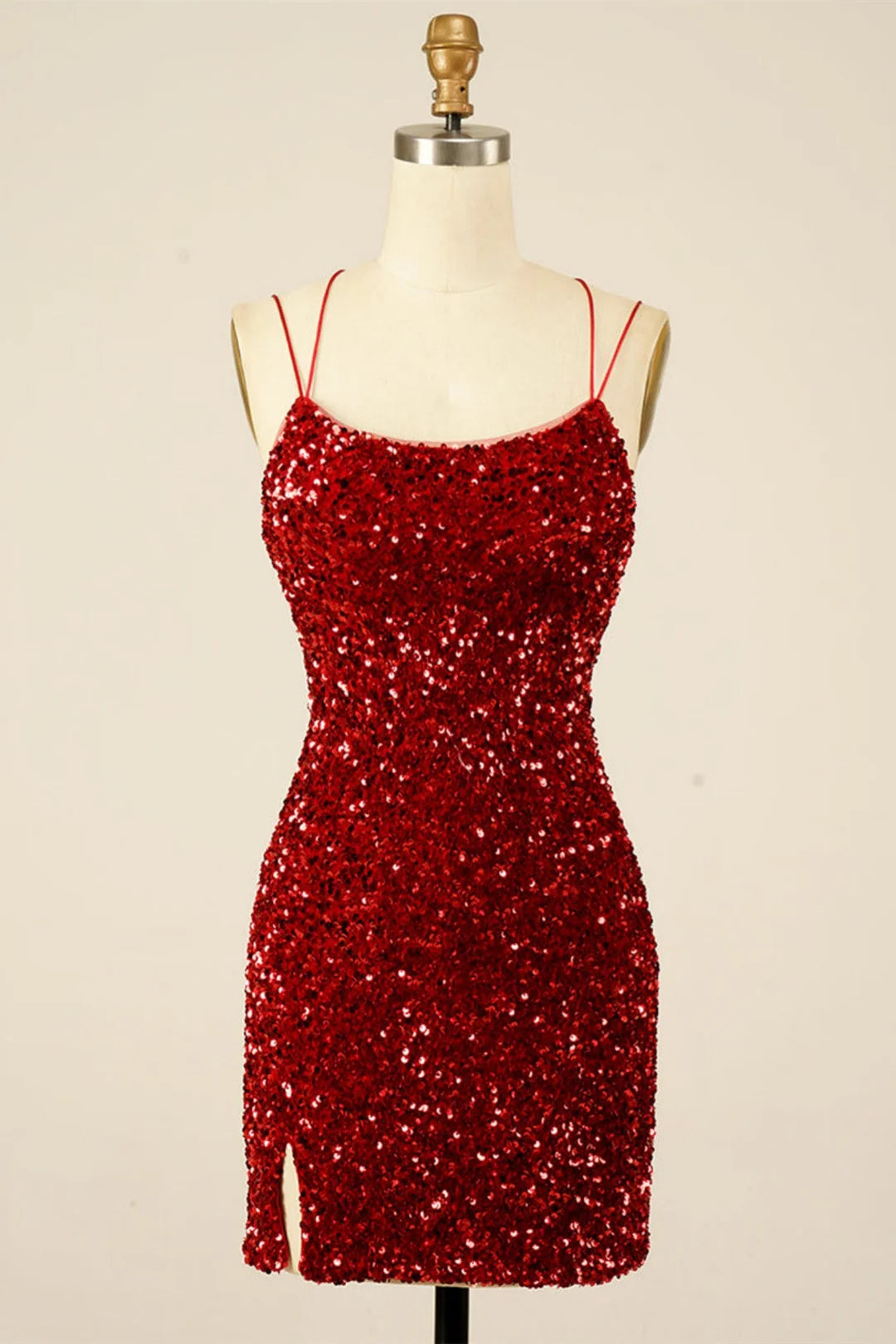 Model wearing a sparkling sequin sheath homecoming dress with a V-neck and lace-up back.