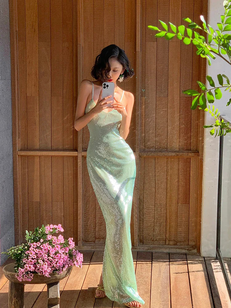 Full length view of sparkling mint green sequin cami prom dress.