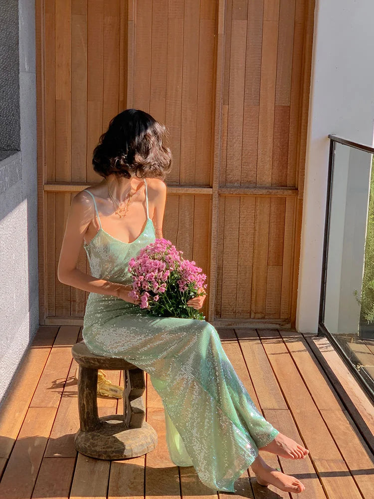 Side view of elegant mint green A-line sequin prom dress.