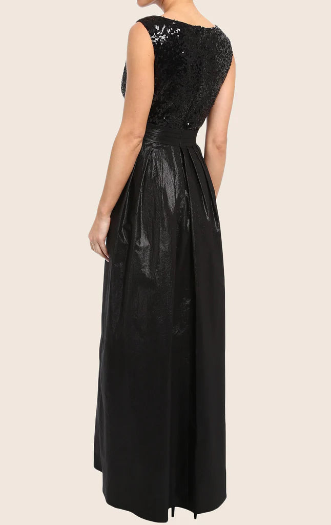 A woman posing in a sequin high-low formal gown, showing the back detail.