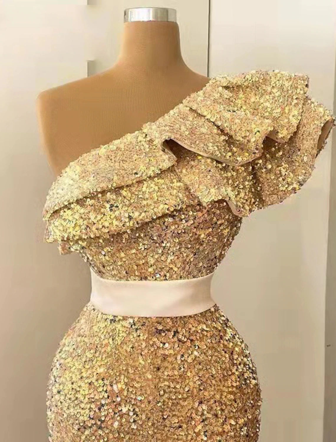 Back view of the mermaid evening gown showing the elegant sweep train.