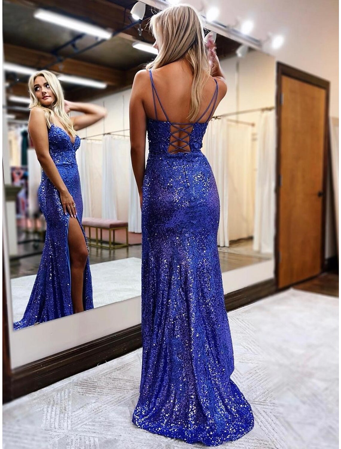 Back view of the sparkling sequined mermaid trumpet prom dress, highlighting the backless design.