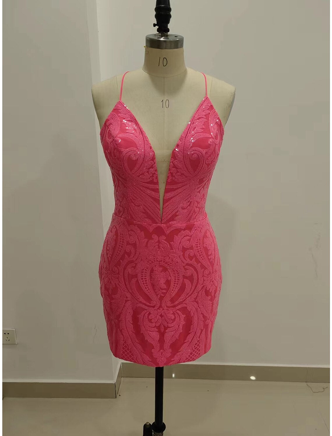 Sparkling sequined mermaid homecoming dress with V-neck and short length.