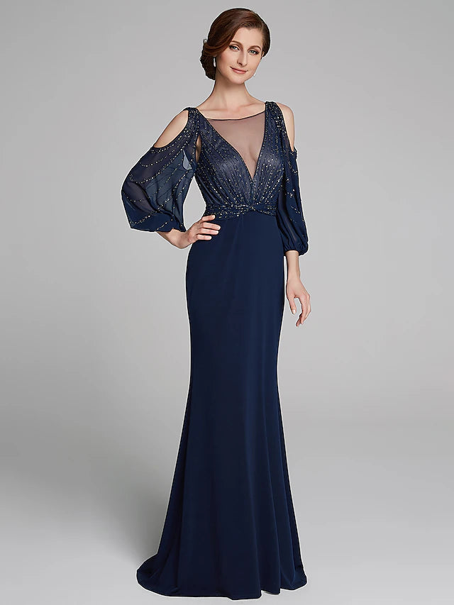 Back view of a sparkling floor-length sheath dress.