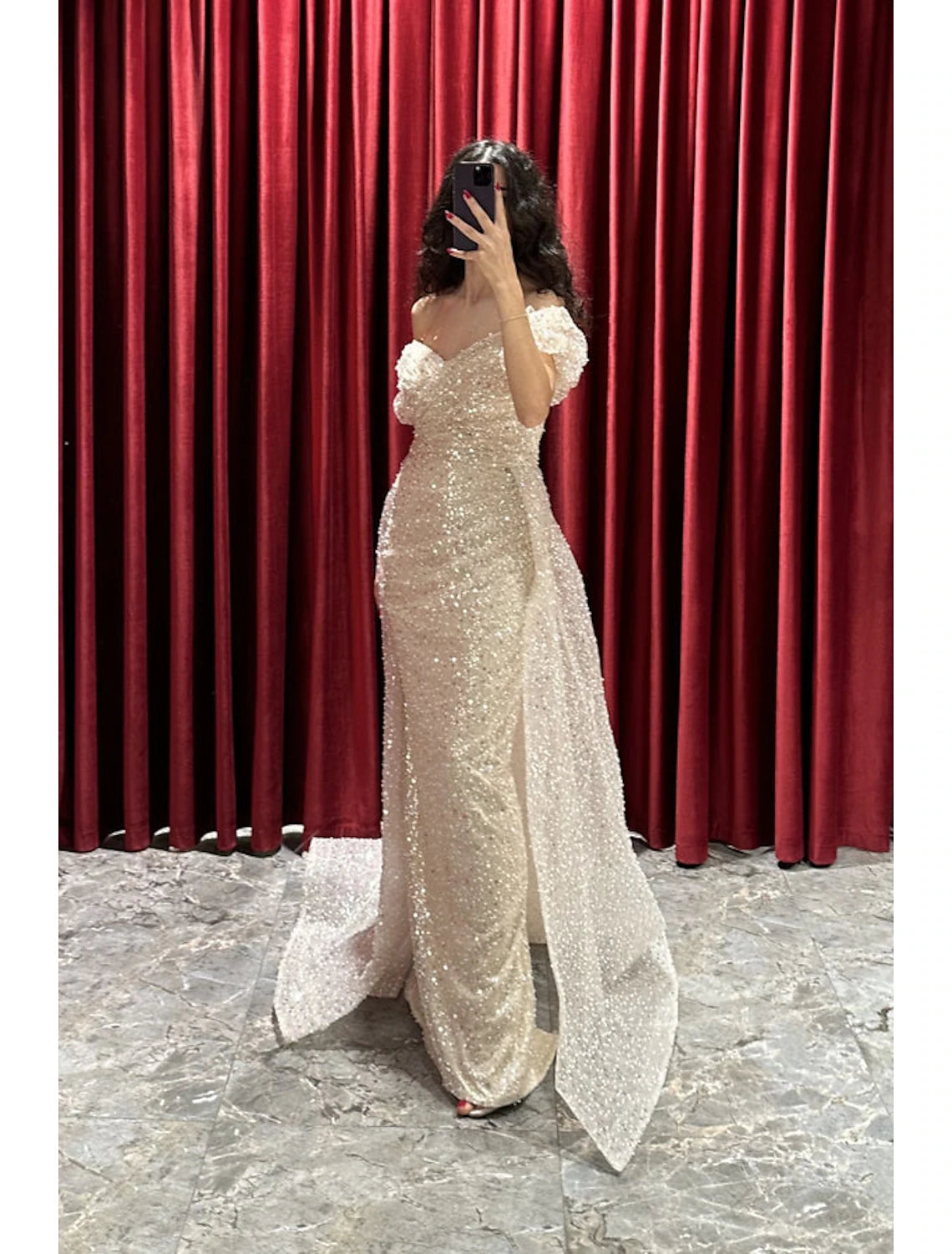 Back view of the sparkling sheath evening gown, showing the sweep train and ruched details.