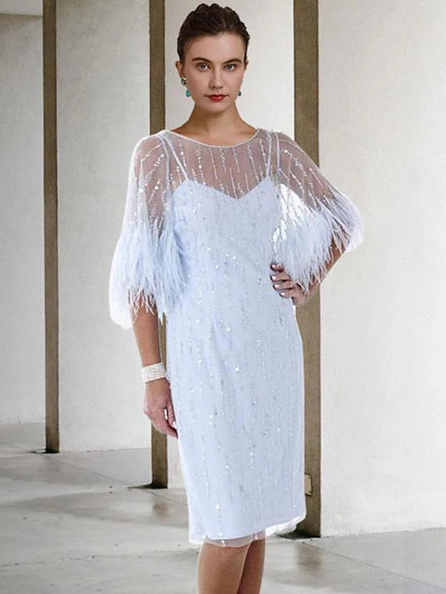 Close-up of the dress fabric, highlighting the stretch chiffon, feather, beading, and sequin embellishments.