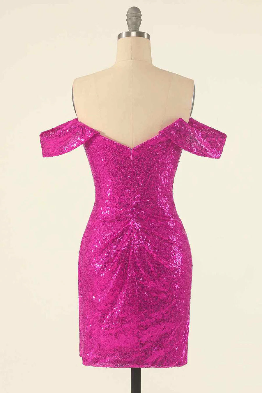 Side view of the navy off-the-shoulder sequin dress on a model.