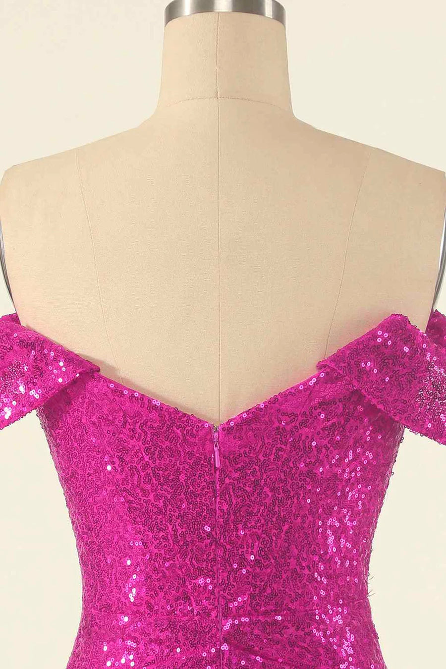 Close-up of the pleated and sequined fabric on the dress.