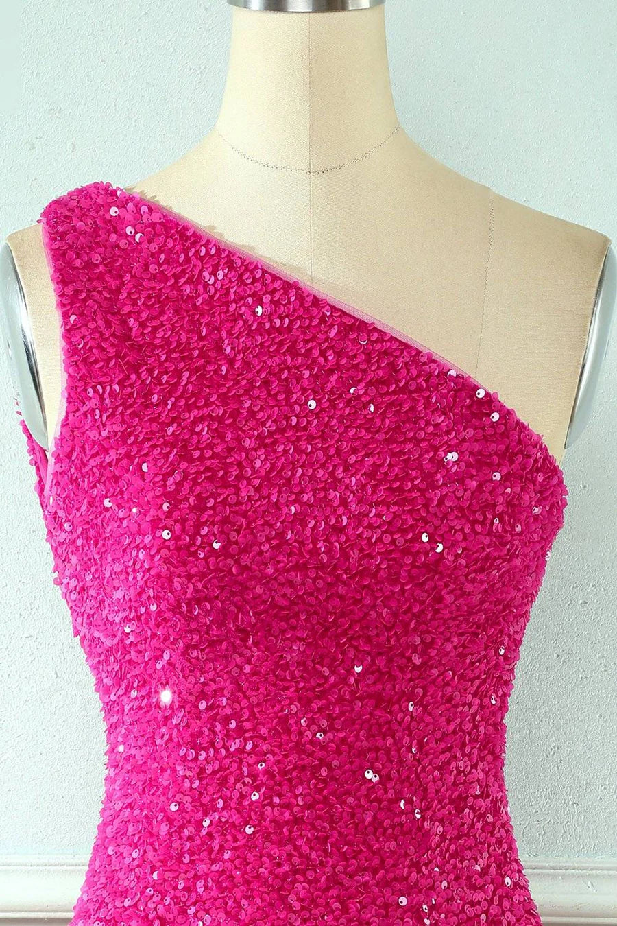 Back view of the sequined one-shoulder homecoming dress, showing strappy detail.