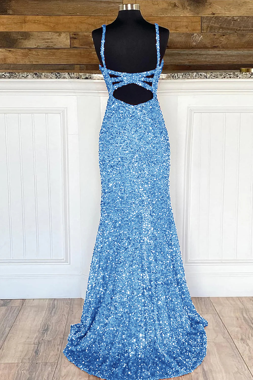 Close-up of sequin detail on the sheath prom dress fabric.
