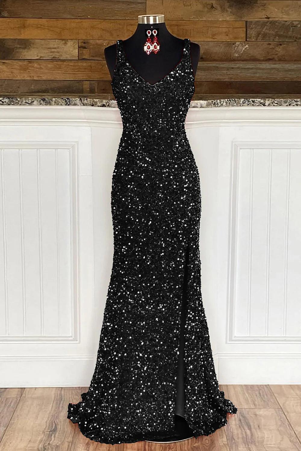 Model posing in the sparkling spaghetti strap sequin dress.