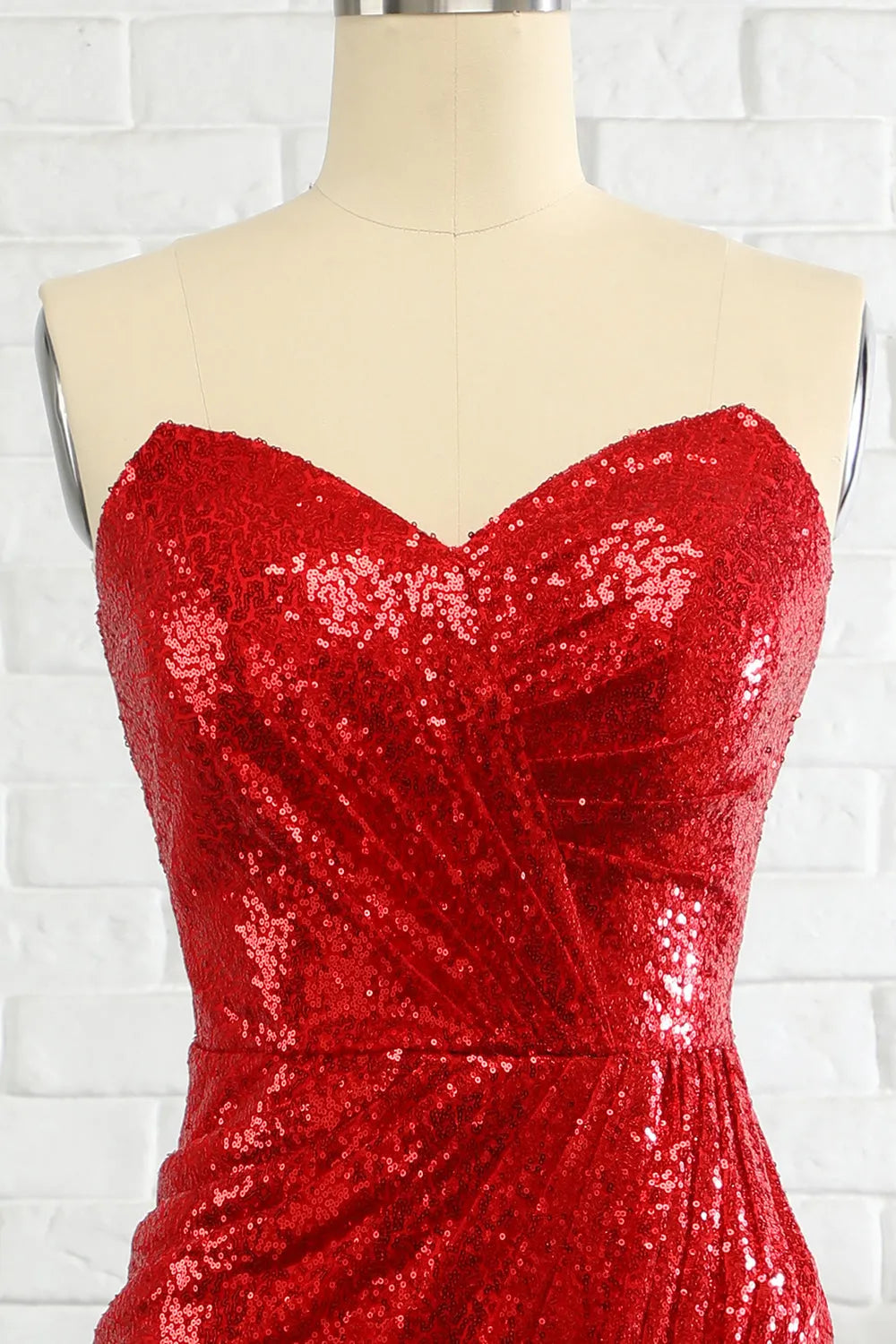 Model wearing a shimmering sheath prom dress.