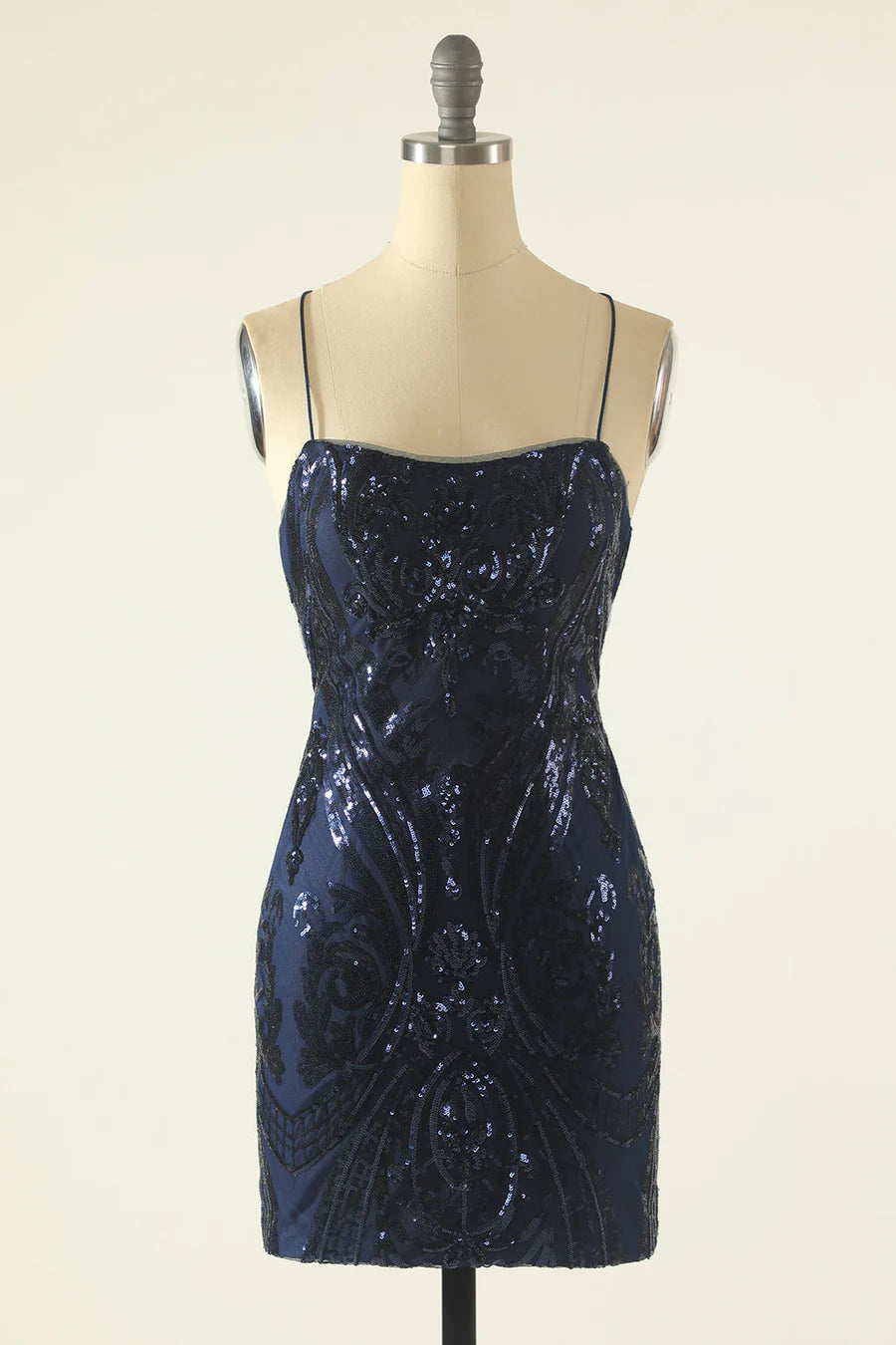 Model wearing a sparkling V-neck sheath homecoming dress with sequin embroidery.