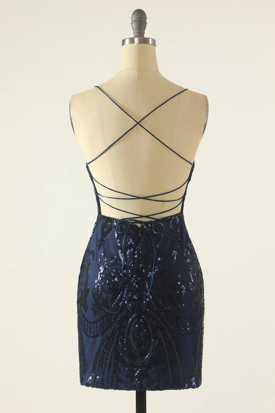 Back view of the sequined sheath dress, showing the elegant lace-up detail.