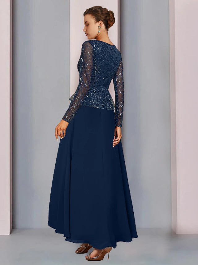 Full view of the sequined lace long sleeve wedding guest dress with asymmetrical details.