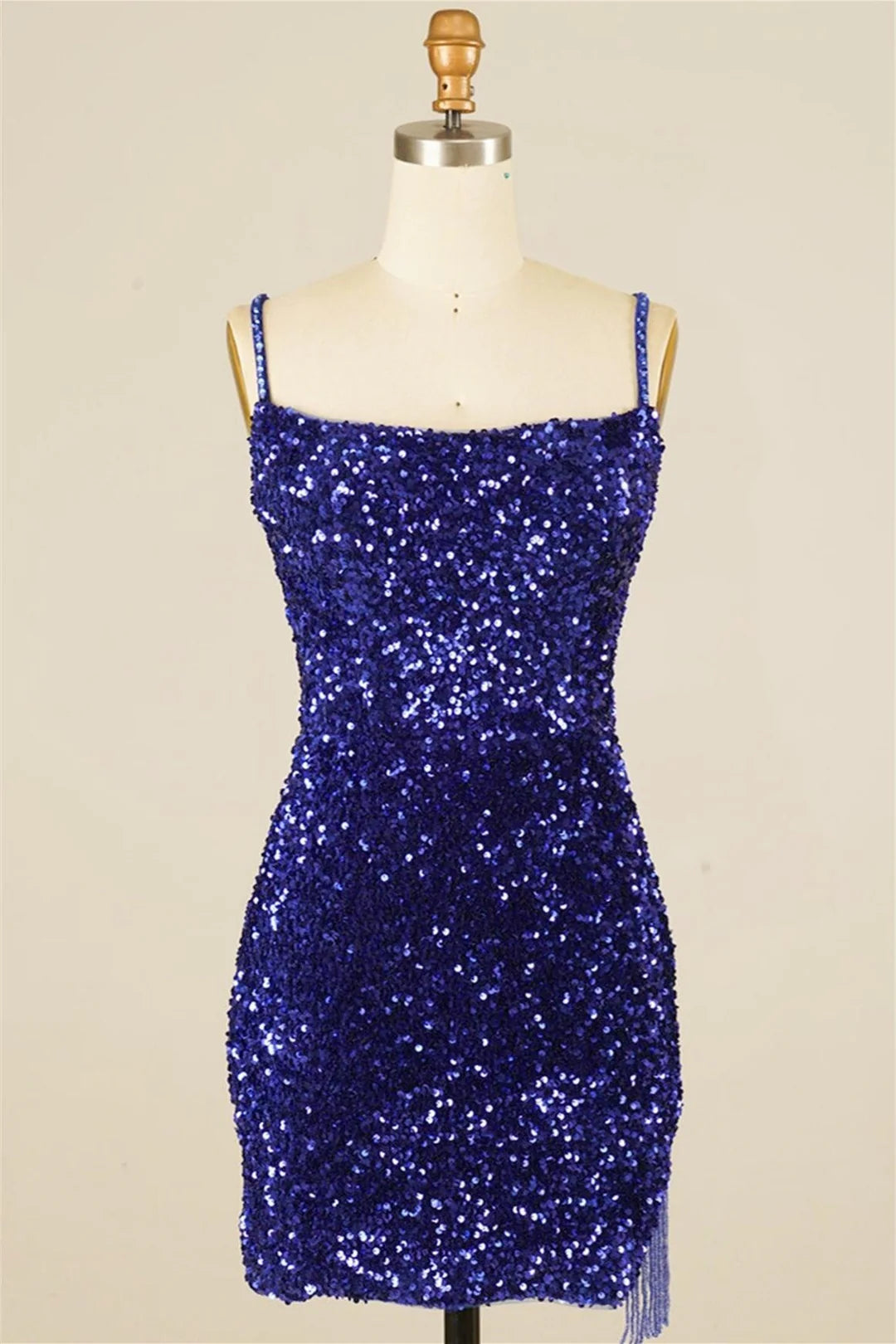 Front view of a sparkling sequined sheath homecoming dress with V-neck and tassels.