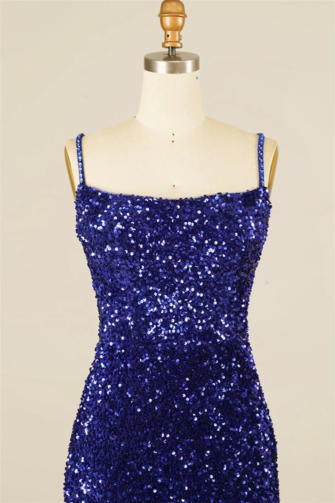 Model posing elegantly in the sparkling V-neck homecoming dress.