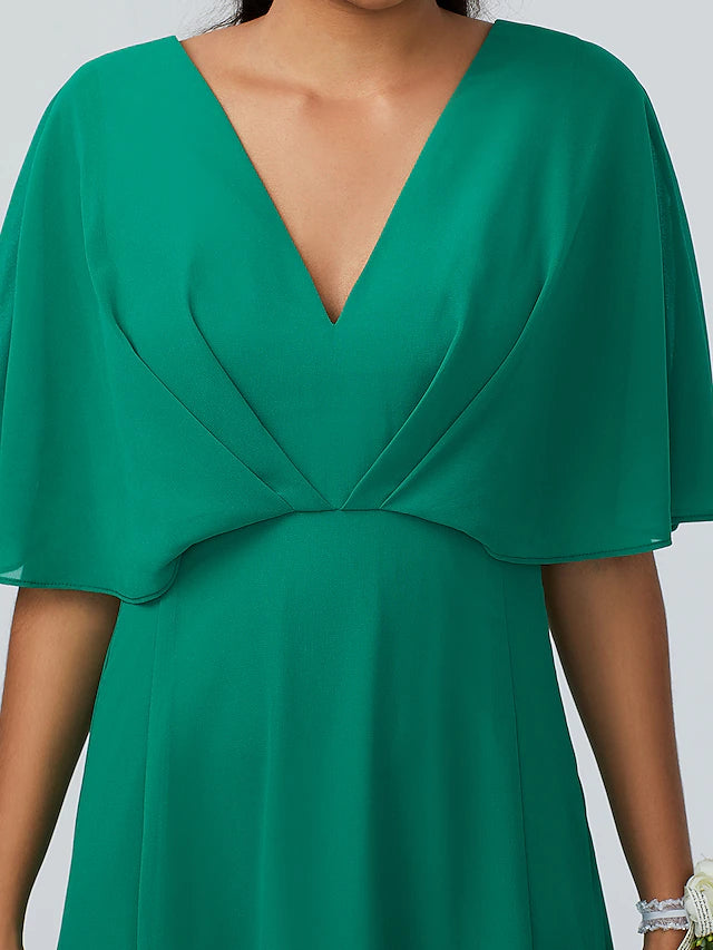 Close-up of the sparkling chiffon fabric and V-neckline on a bridesmaid dress.