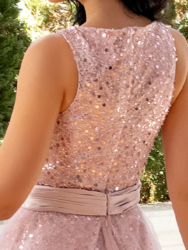 Back view of the sleeveless tea-length cocktail dress, showcasing its sheath silhouette.