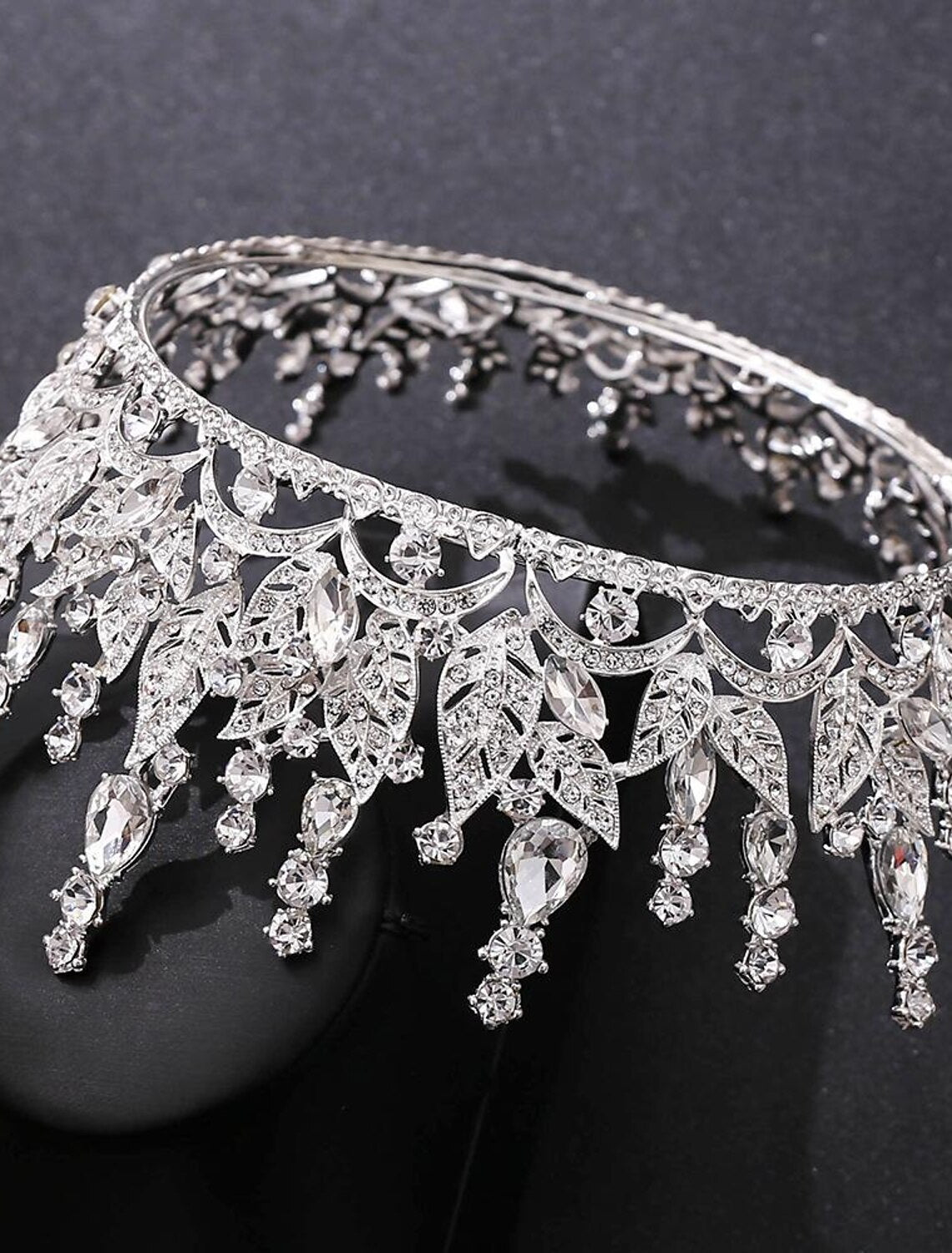 Elegant silver tiara crown displayed on a white background.