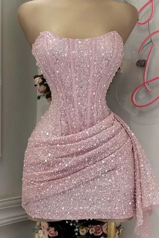 Blushing pink strapless sequin mini homecoming dress.