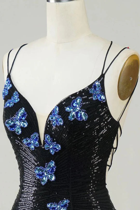 Close-up of sequin butterfly detail on glitter dress.