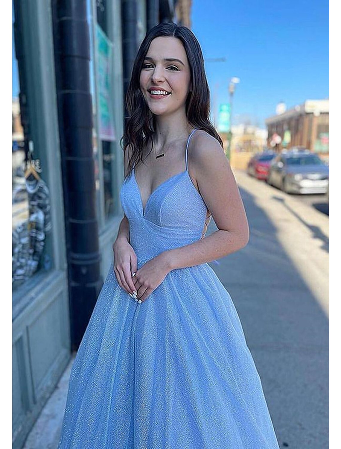 Side view of elegant sparkling tulle prom dress with A-line silhouette.