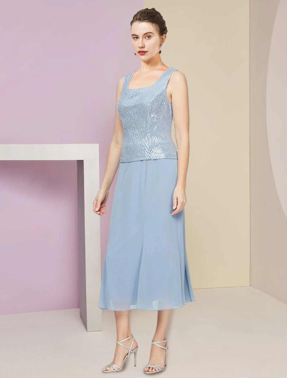 Back view of the formal dark blue sequined dress with a modest scoop neck.