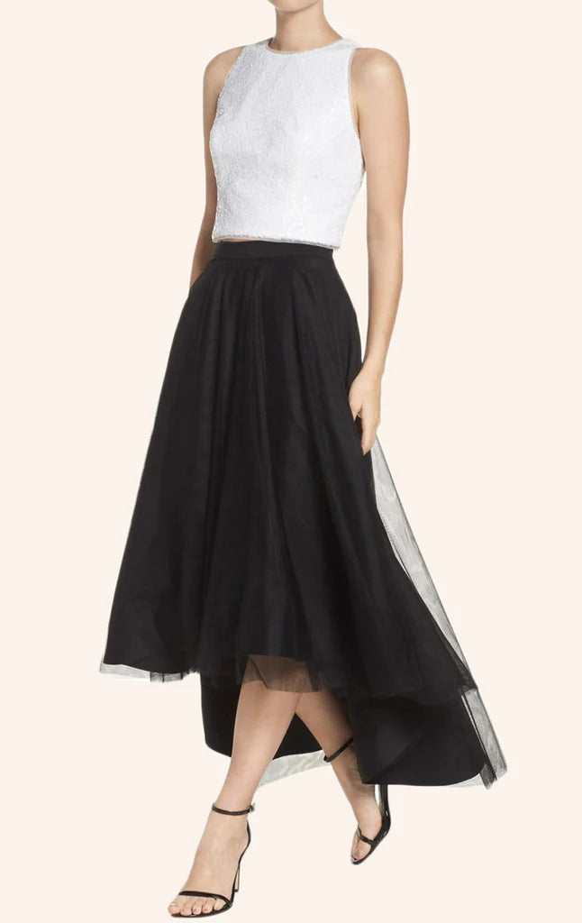 Back view of a woman wearing an elegant two-piece formal high-low dress.