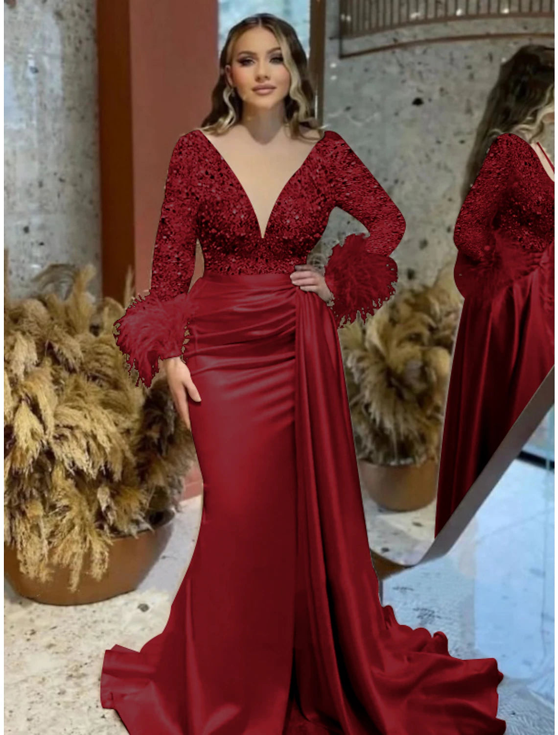 Close-up of the V-neckline and long sleeves with glitter details on the gown.
