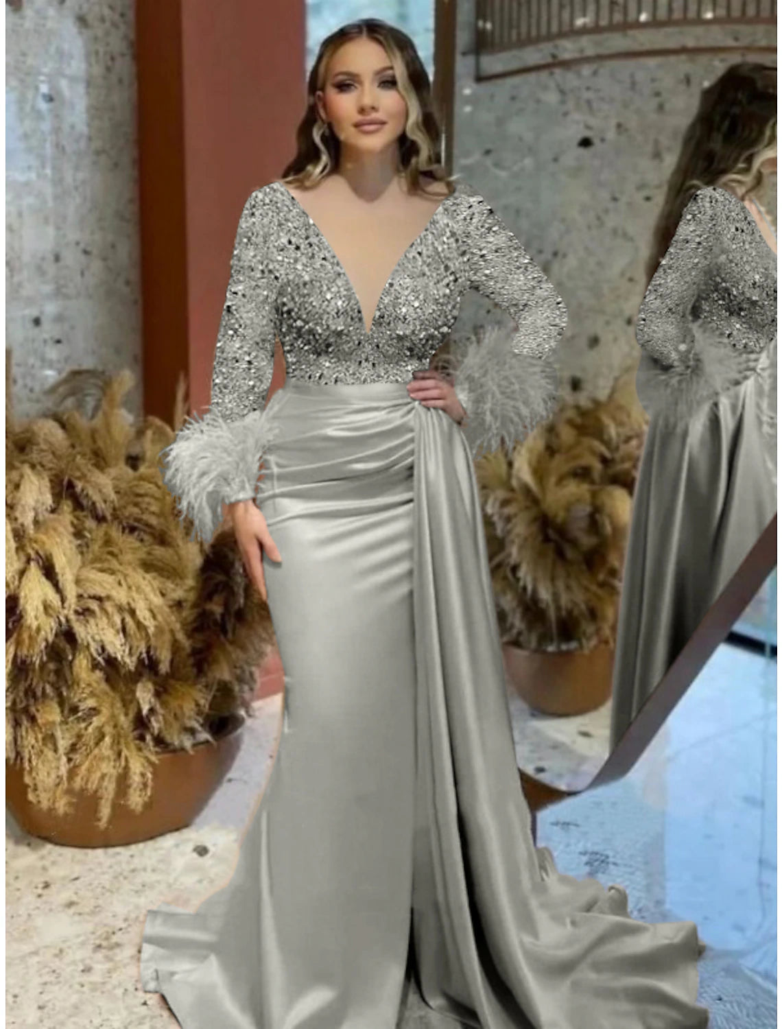 Side view of the ruched detailing on the sparkling mermaid trumpet gown.