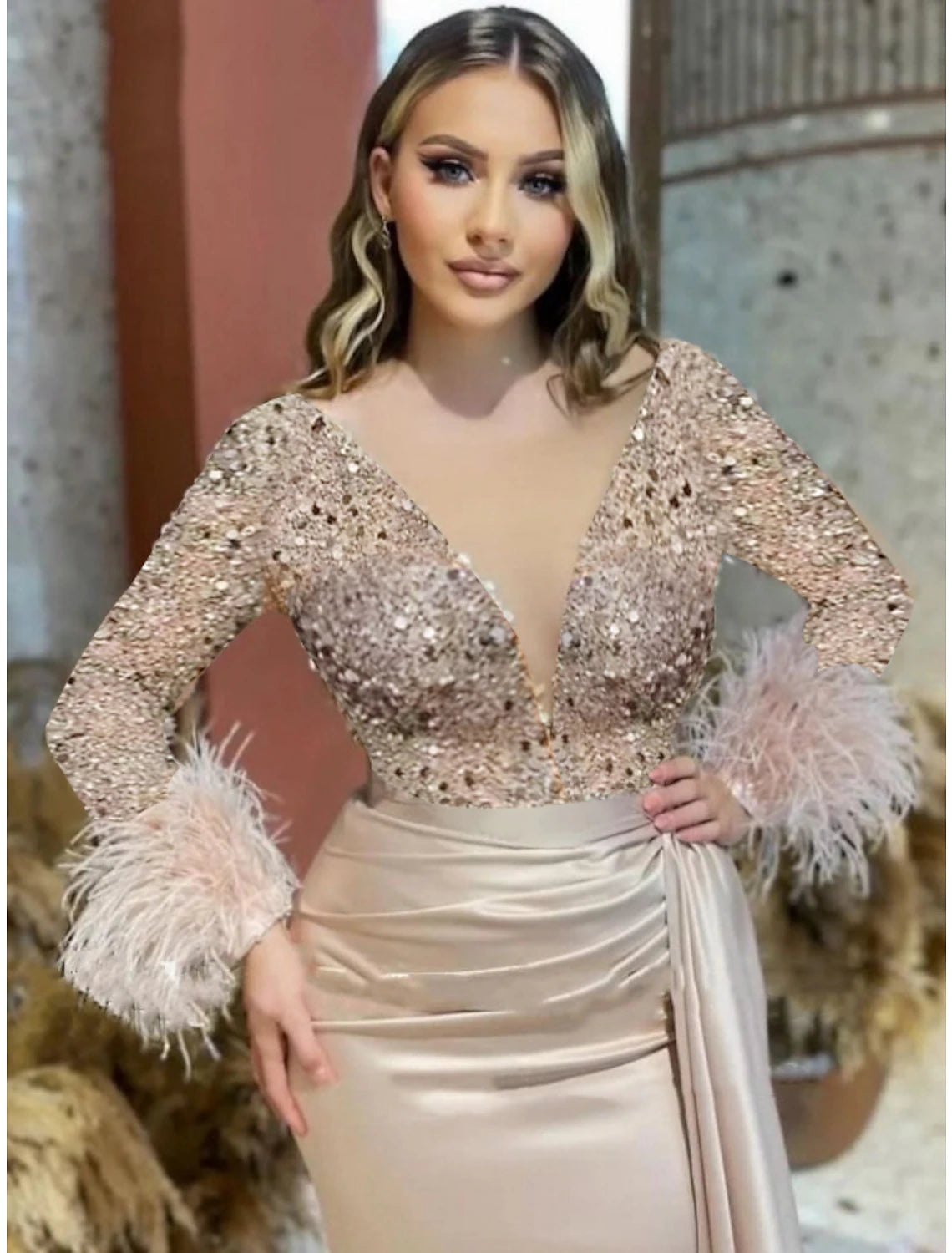 Model posing elegantly in the sparkling mermaid trumpet formal dress.