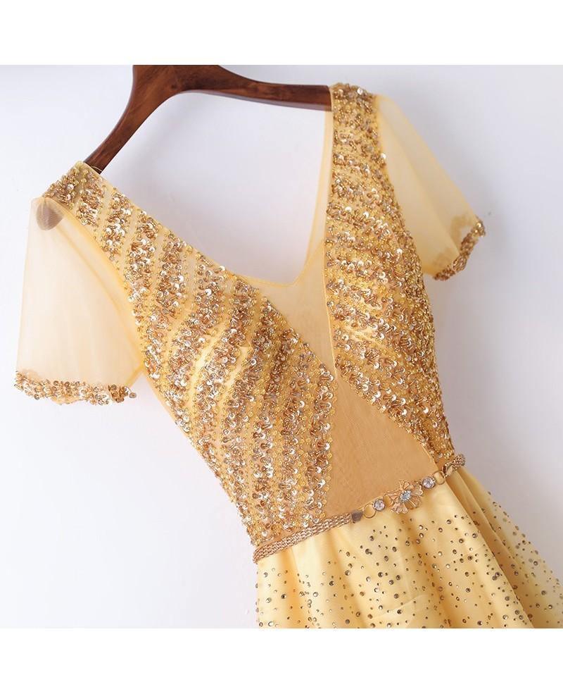 Elegant A-line prom gown with sparkly details on a model.