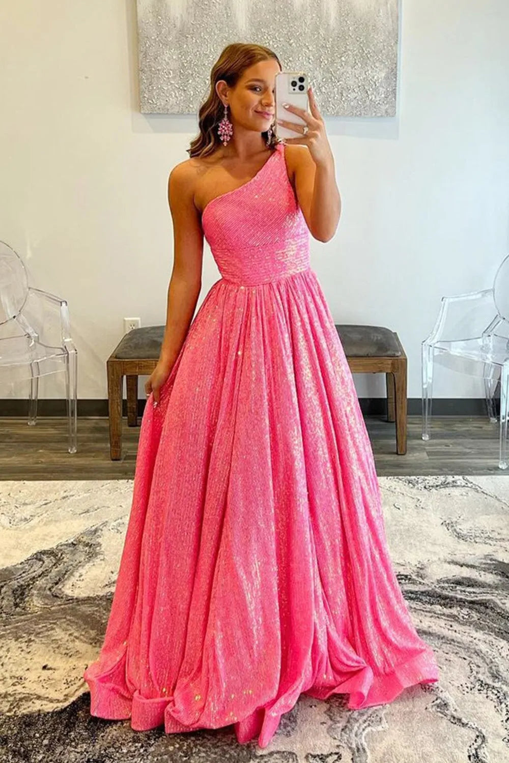 Sparkly A-line one-shoulder sequin prom dress.