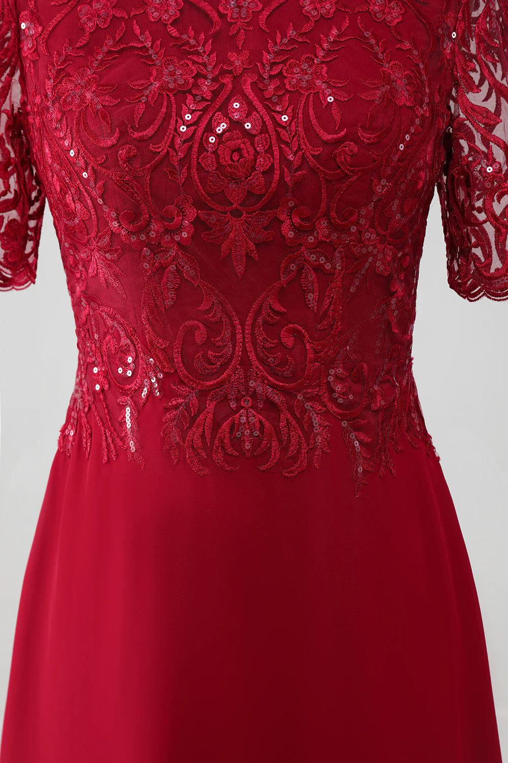 Back view of a woman in a burgundy A-line sequin dress.