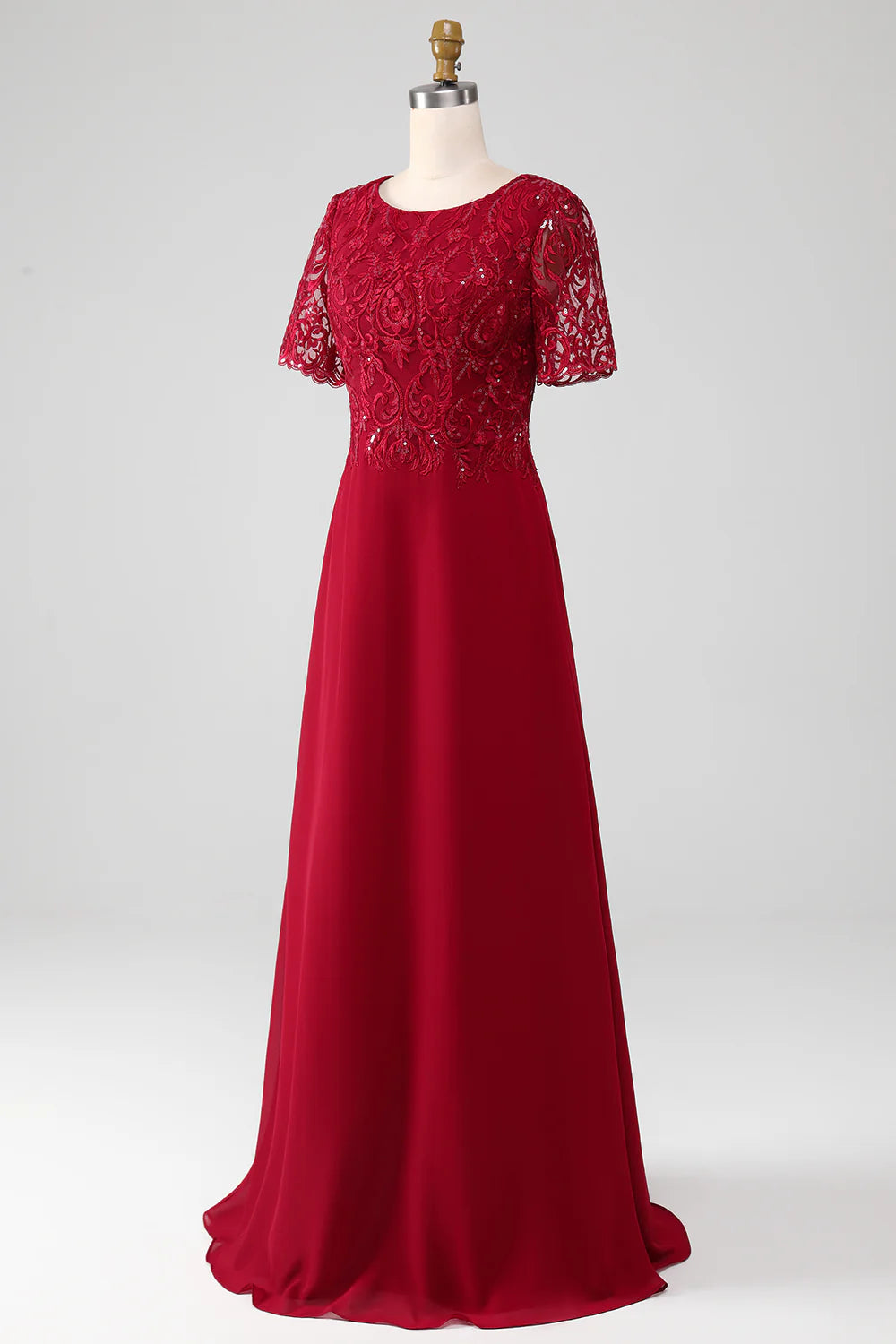 Burgundy sequin dress with round neck and appliques.